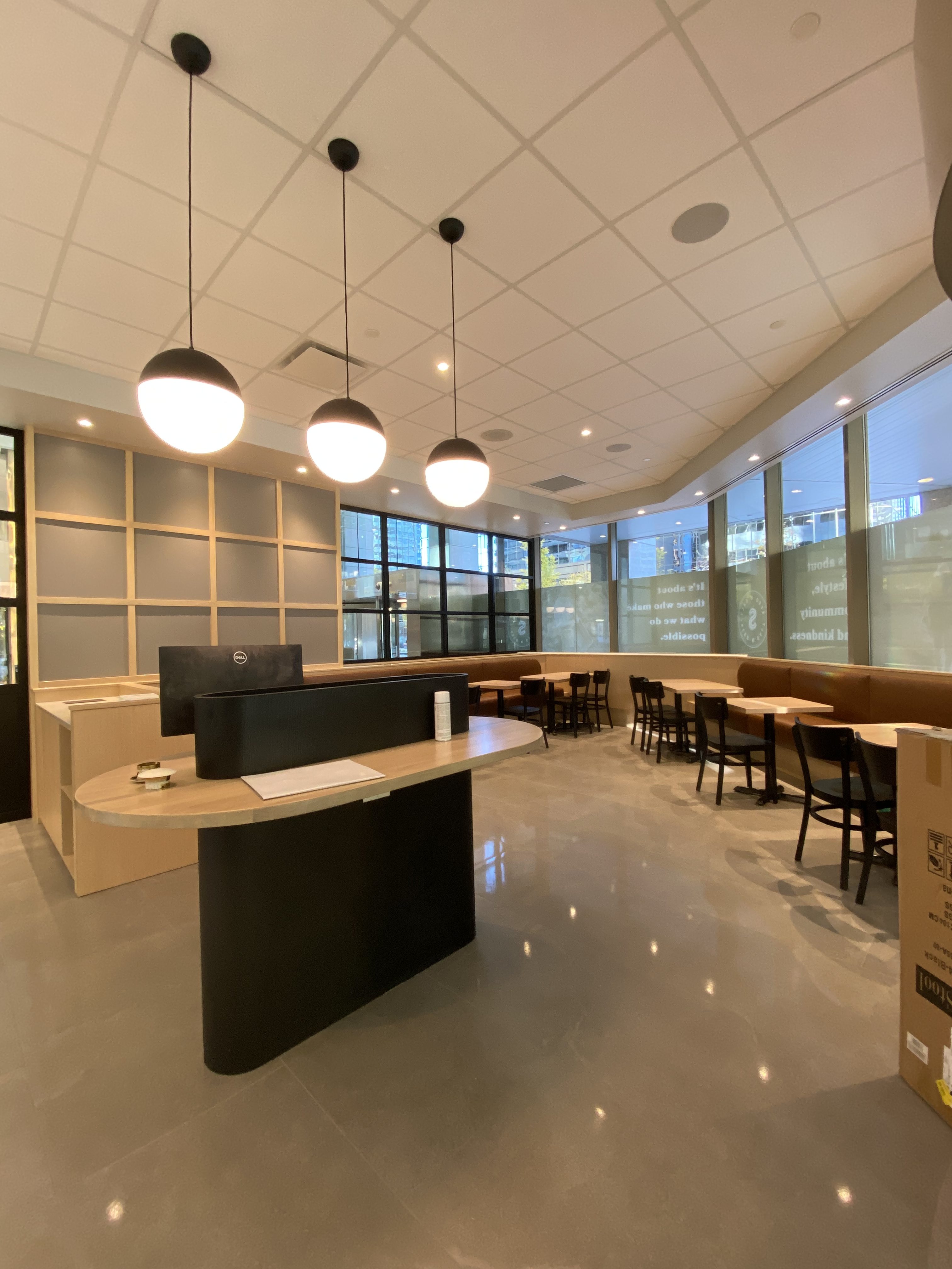 Custom millwork reception and dining area at Seed & Salt